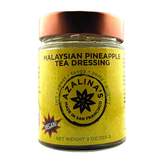 Jar of Malaysian Pineapple Tea Dressing with a yellow label on a white background