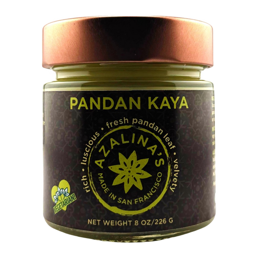 Jar of Pandan Kaya with a bronze lid on a white background